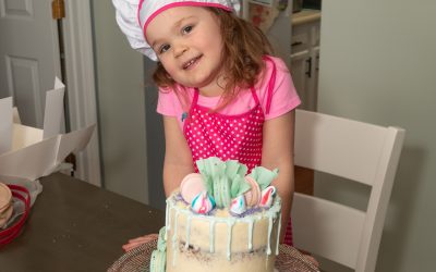 Naked Chocolate Cake With Swiss Meringue Icing Top with Macaroon White Chocolate Ruffles.