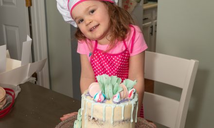 Naked Chocolate Cake With Swiss Meringue Icing Top with Macaroon White Chocolate Ruffles.